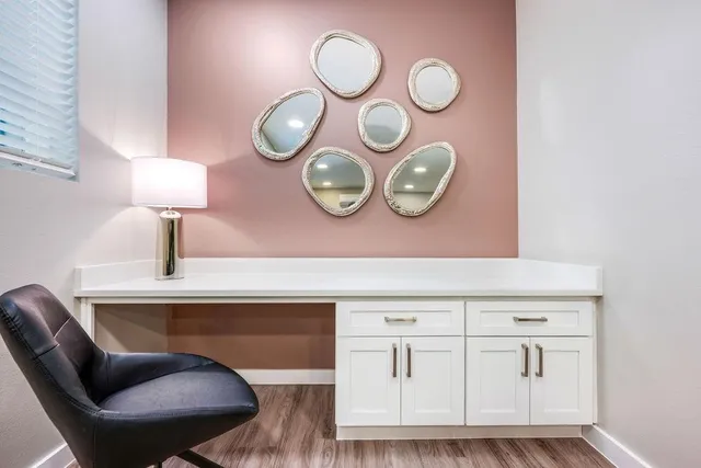 a living room with furniture and potted plant