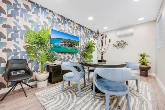 a bed room with a bed and a chair