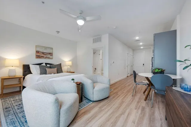 a bedroom with a bed and a couch