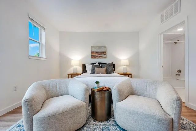 a view of a hallway view with wooden floor and staircase