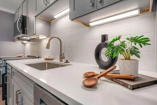 a kitchen with a sink and a stove