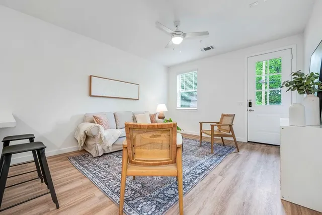a living room with furniture and a table