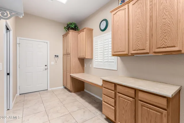a lobby with a couch and potted plants
