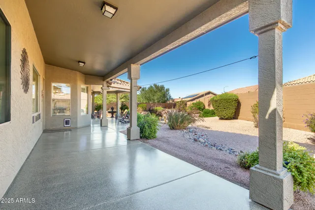 a front view of a house with a yard and outdoor seating