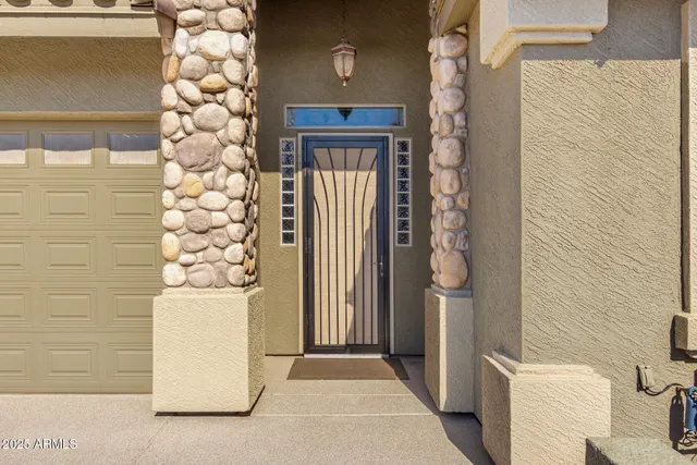 a living room with furniture a rug and white walls