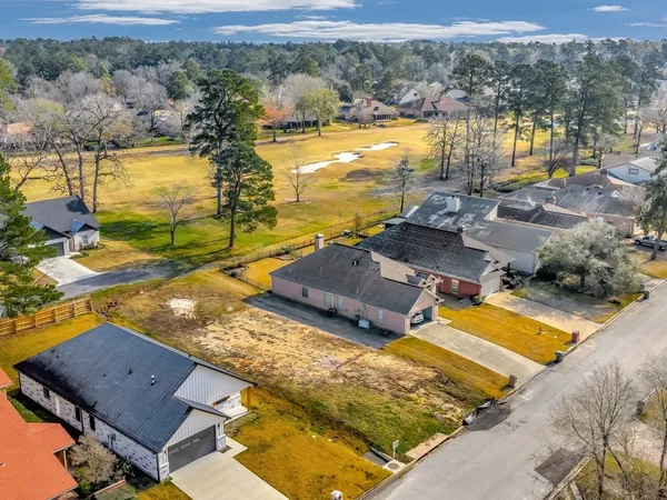 an aerial view of a house with a ocean view