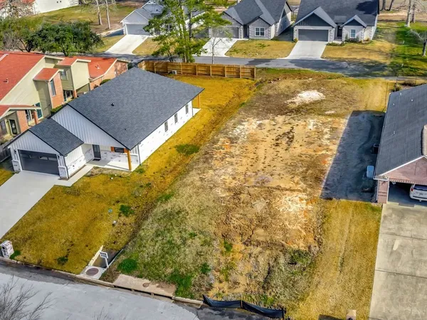 a view of residential houses with swimming pool