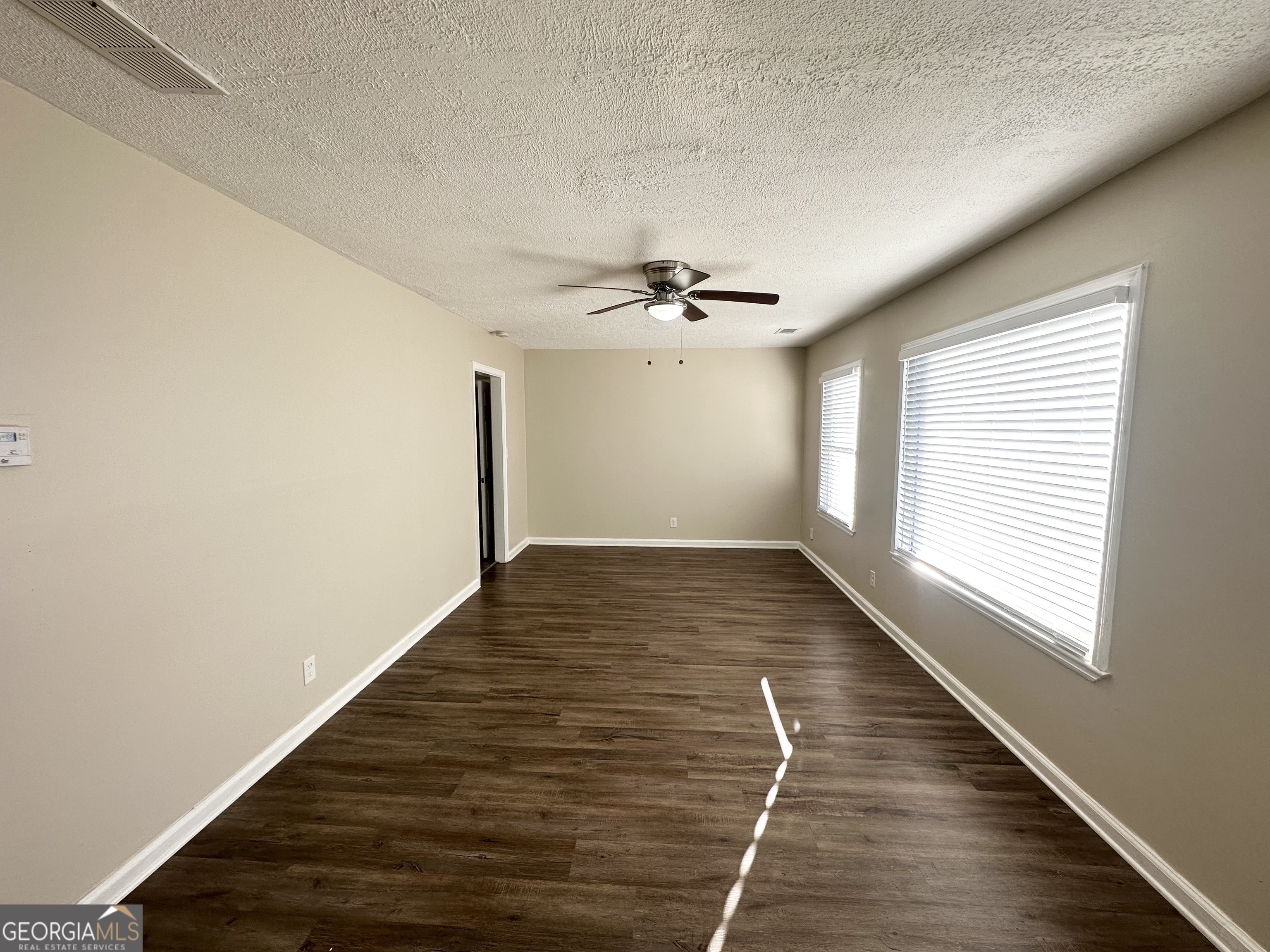 3438 Maryvale Drive Decatur, GA 30032 - Photo 3 of 13 wooden floor in an empty room with a window