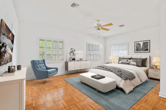 a bedroom with a bed couch and window