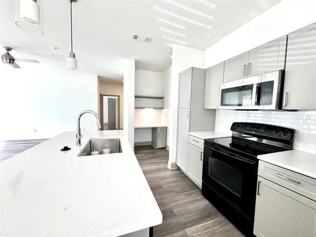 a kitchen with a stove and a microwave