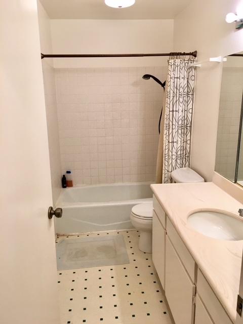 4409 Catlin Circle, Unit B Carpinteria, CA 93013 - Photo 11 of 13 a bathroom with a sink a toilet and shower