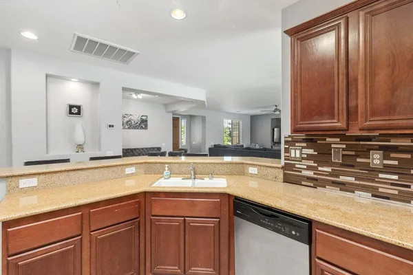 a kitchen with a sink and cabinets
