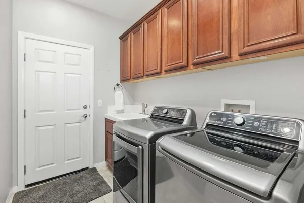 a utility room with dryer and washer