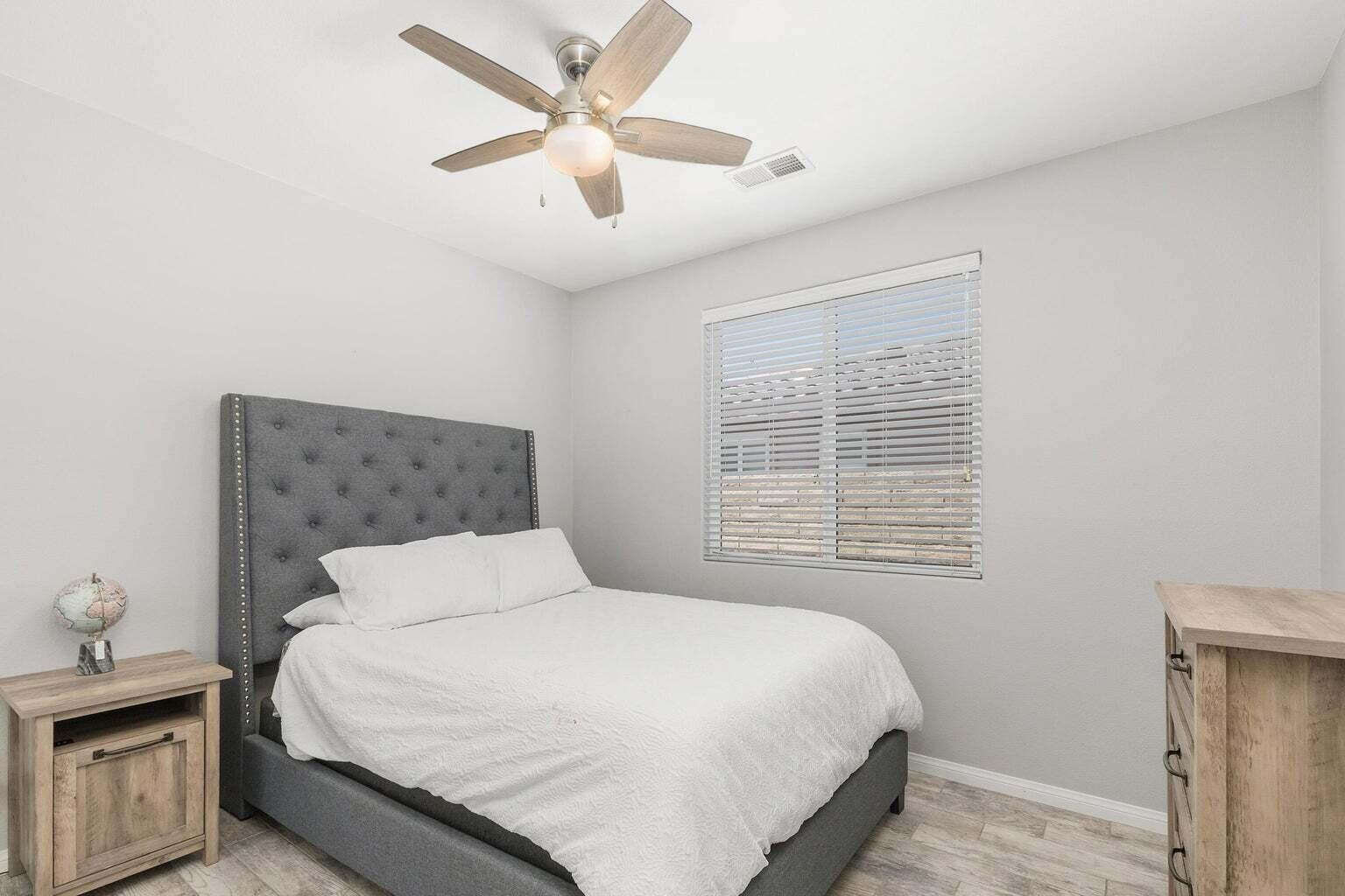 83631 Himalaya Drive Indio, CA 92203 - Photo 23 of 36 a bedroom with a bed and a window