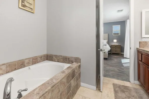 a bathroom with a tub and shower