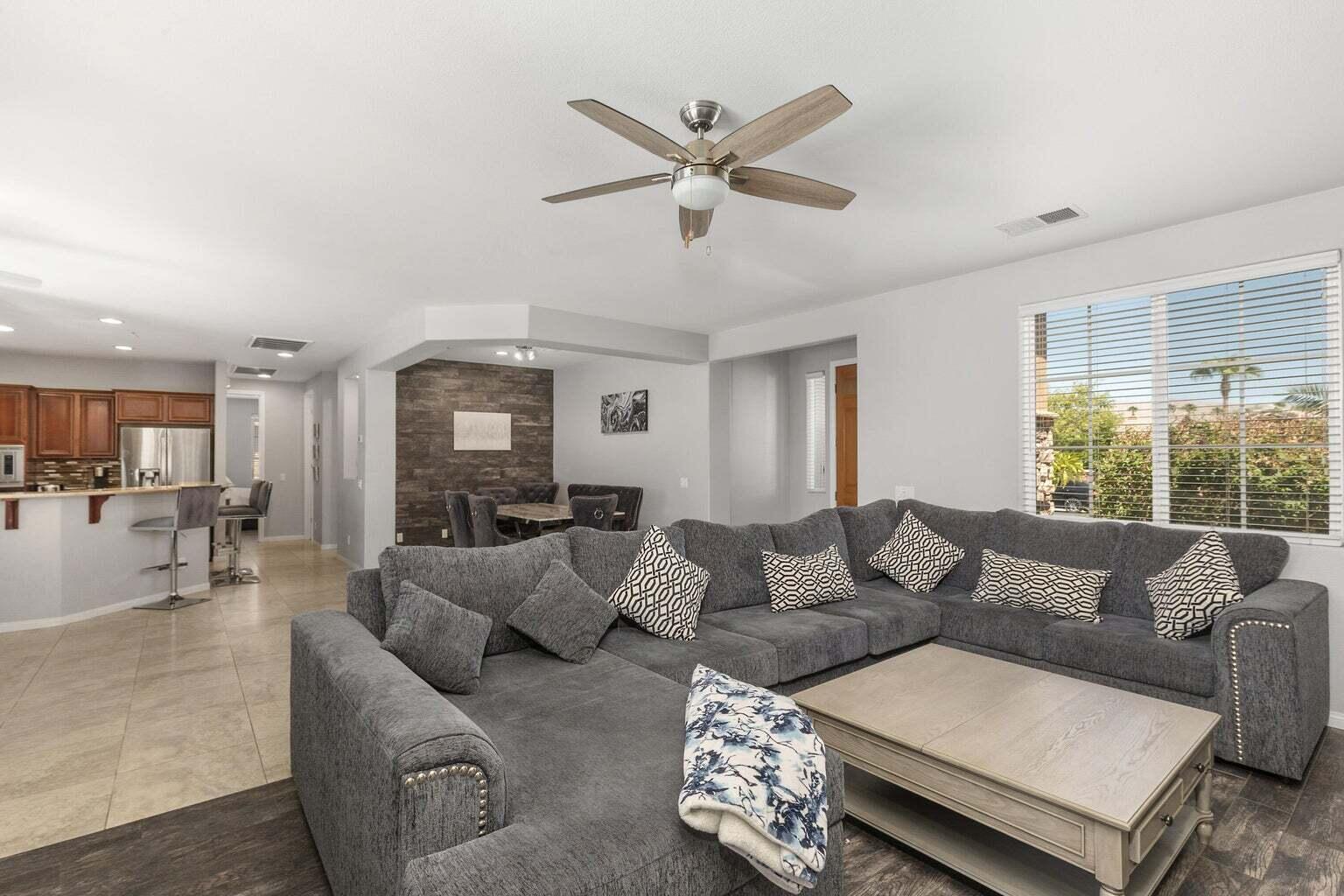 83631 Himalaya Drive Indio, CA 92203 - Photo 10 of 36 a living room with furniture and a large window