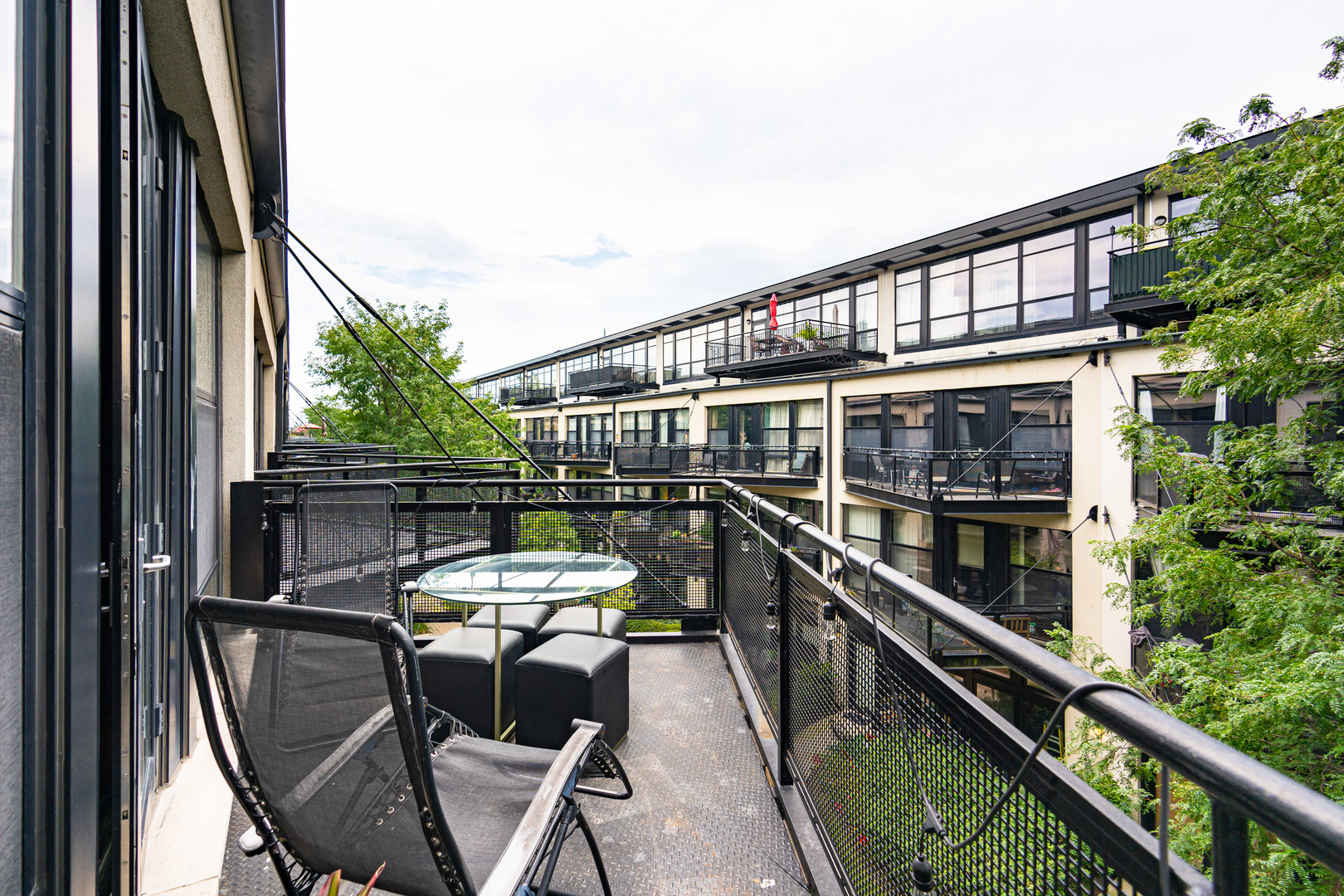 1069 West 14th Place, Unit 305 Chicago, IL 60608 - Photo 17 of 26 a view of a balcony with chairs