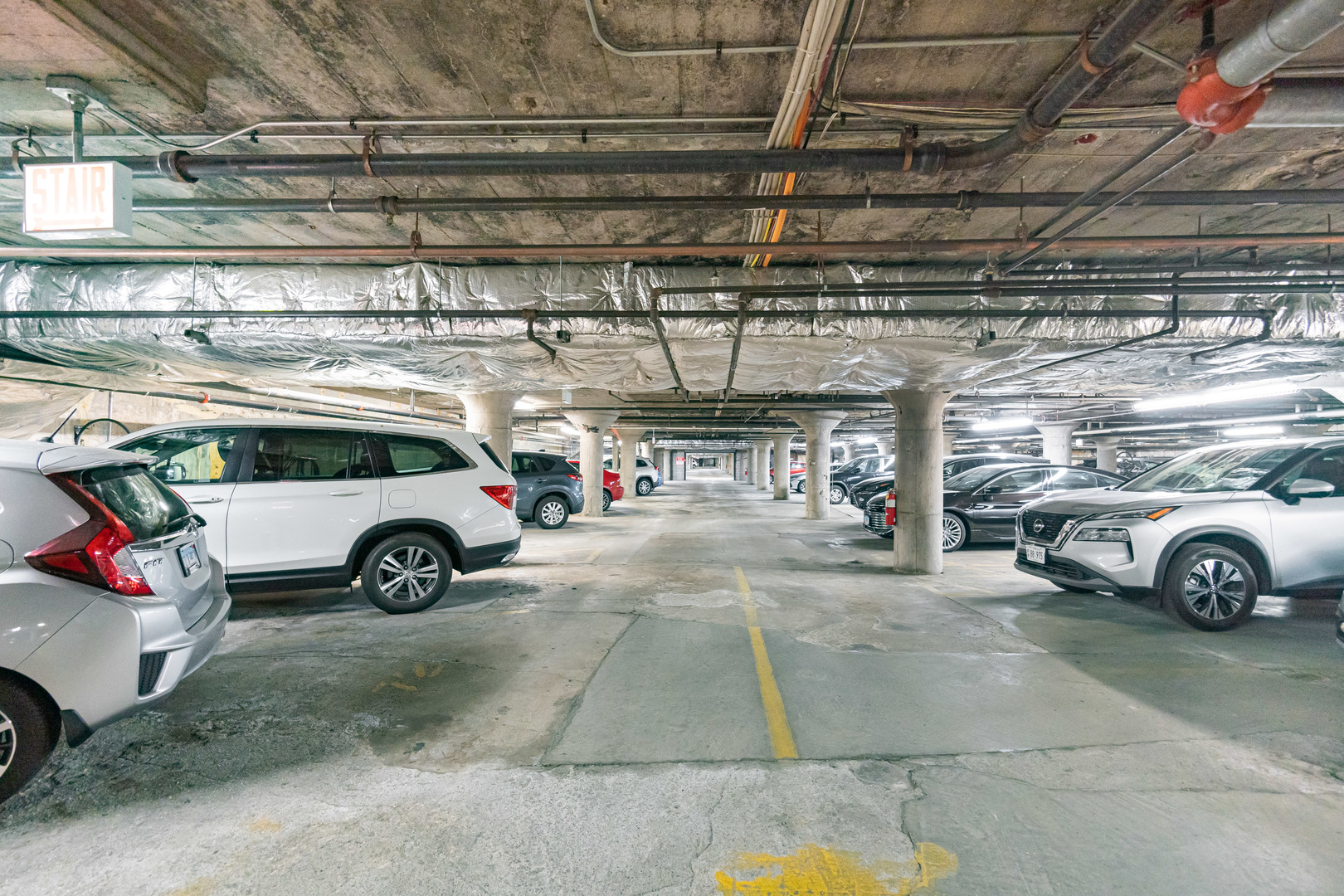 1069 West 14th Place, Unit 305 Chicago, IL 60608 - Photo 24 of 26 a view of parking garage with a garage