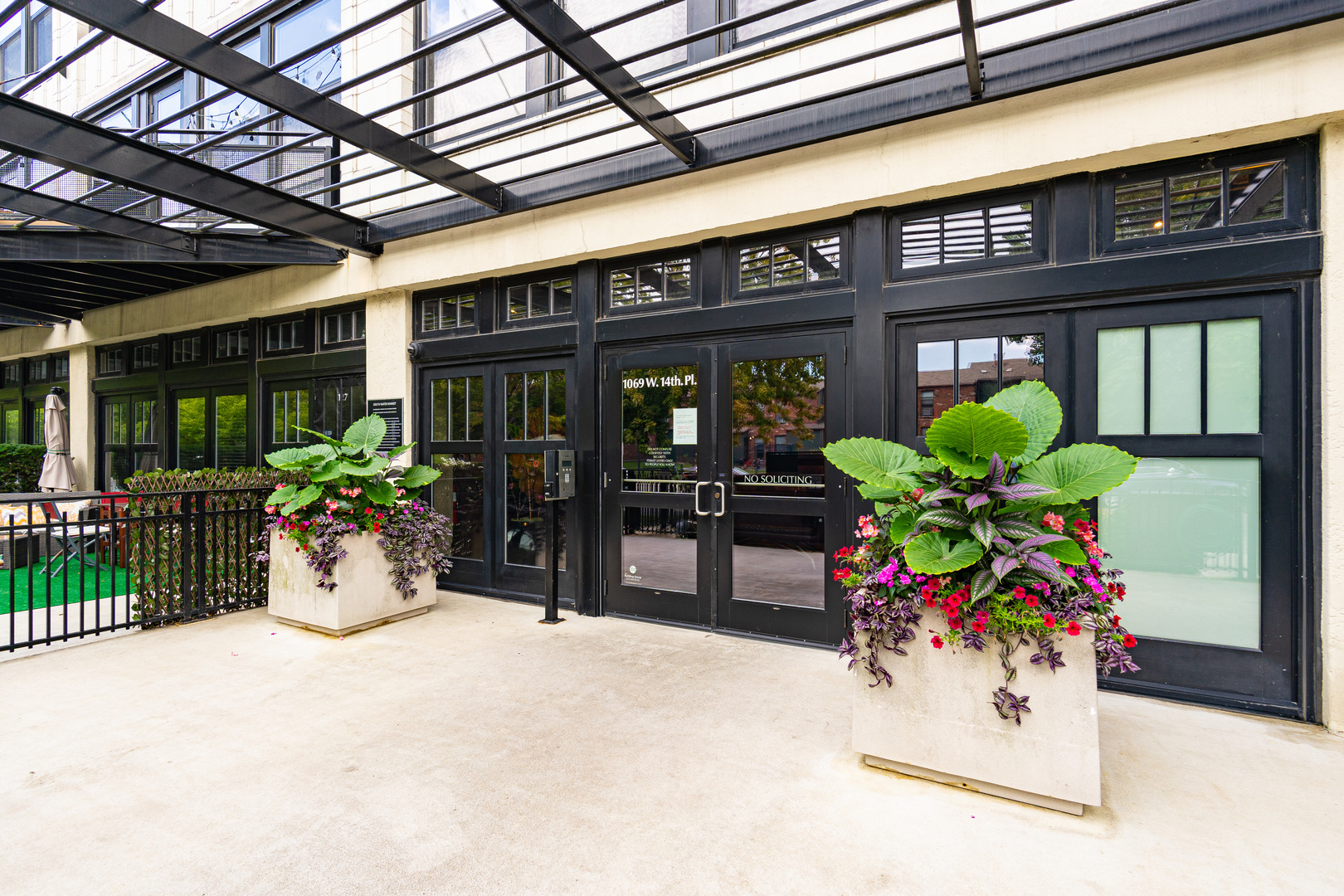 1069 West 14th Place, Unit 305 Chicago, IL 60608 - Photo 26 of 26 a building exterior with furniture