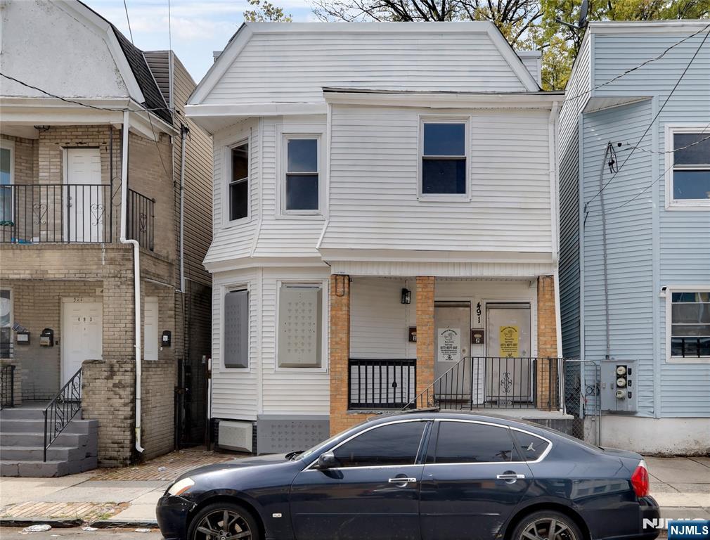 491 South 17th Street Newark, NJ 07103 - Photo 1 of 22 a front view of a house with parking space