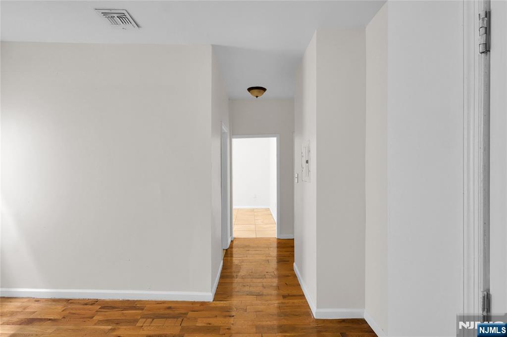 491 South 17th Street Newark, NJ 07103 - Photo 13 of 22 a view of a hallway with wooden floor