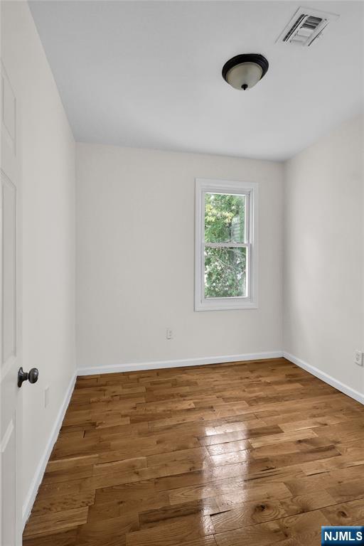 491 South 17th Street Newark, NJ 07103 - Photo 19 of 22 wooden floor in an empty room