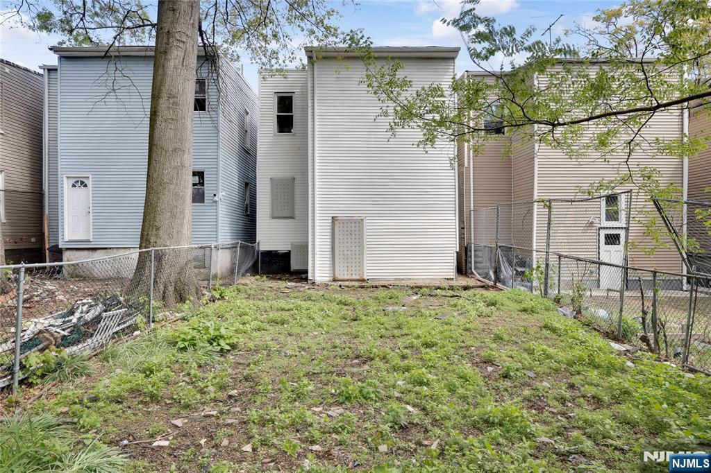 491 South 17th Street Newark, NJ 07103 - Photo 22 of 22 a house with a tree in front of it