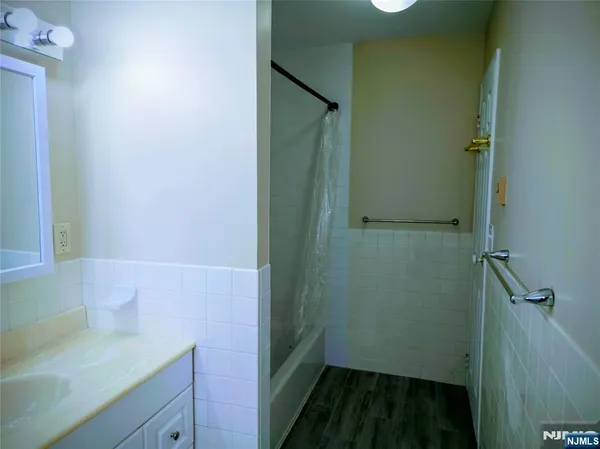 a bathroom with a sink and mirror