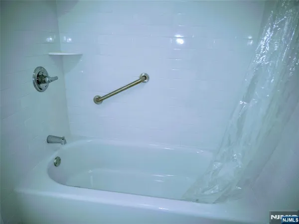 a close up of a bathtub in a bathroom