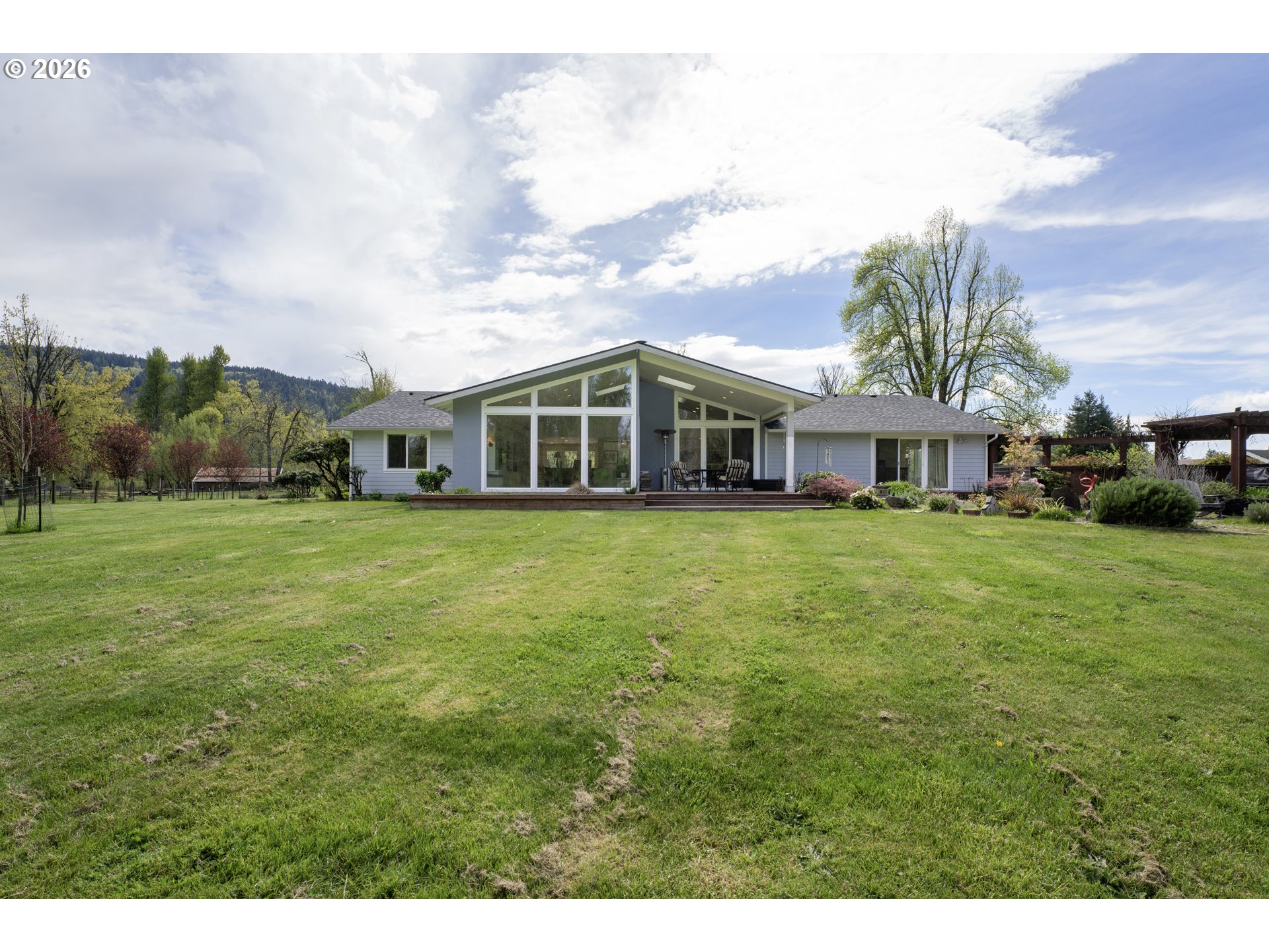7924 Thurston Road Springfield, OR 97478 - Photo 34 of 45 a view of a house with a big yard and large trees