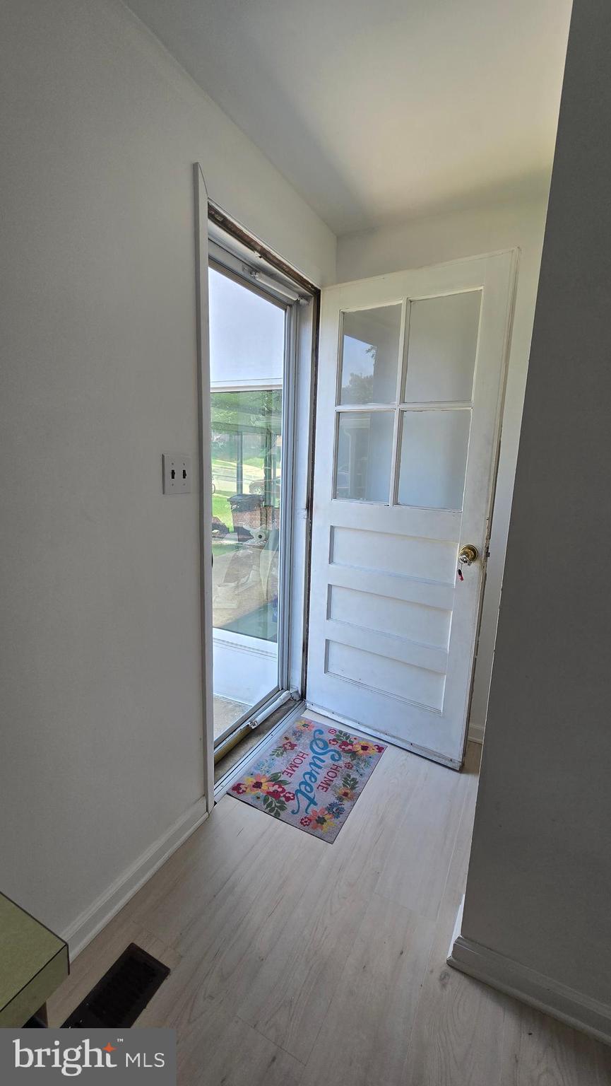 1016 Grovehill Road Baltimore, MD 21227 - Photo 31 of 65 Door in kitchen leads to rear yard.