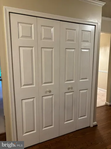 an empty room with wooden floor