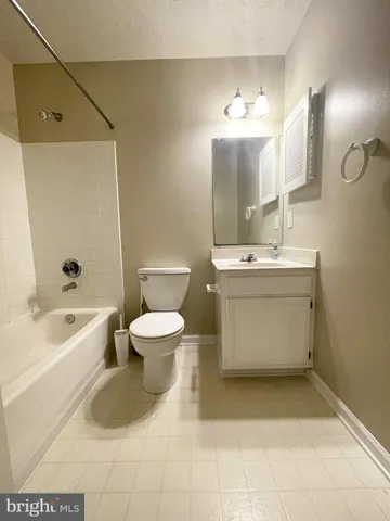 a bathroom with a sink a toilet and bathtub