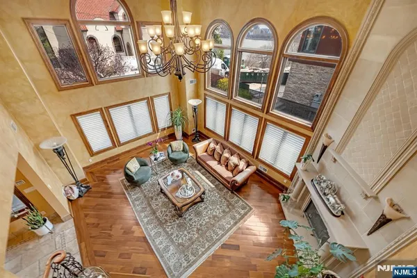 a bedroom with furniture and a wooden floor