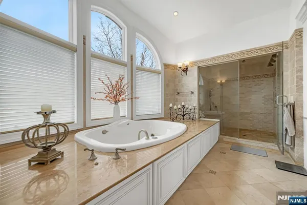 a bathroom with a shower and a bathtub