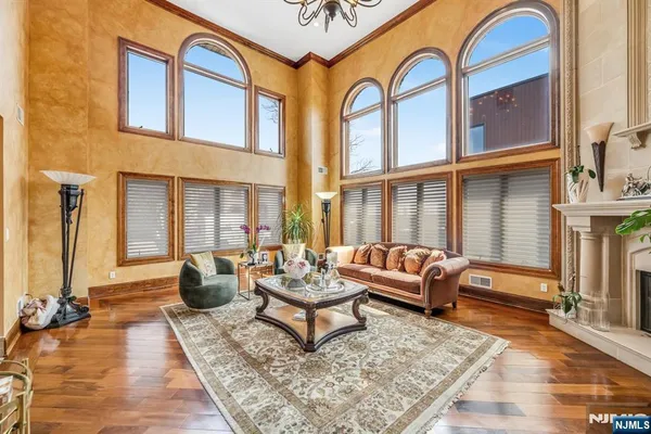 a kitchen with stainless steel appliances a stove a sink dishwasher and a refrigerator with wooden cabinets