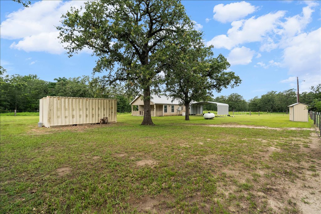 608 Whistleville Road Flatonia, TX 78941 - Photo 16 of 26 Mature oak trees completely surround this property.