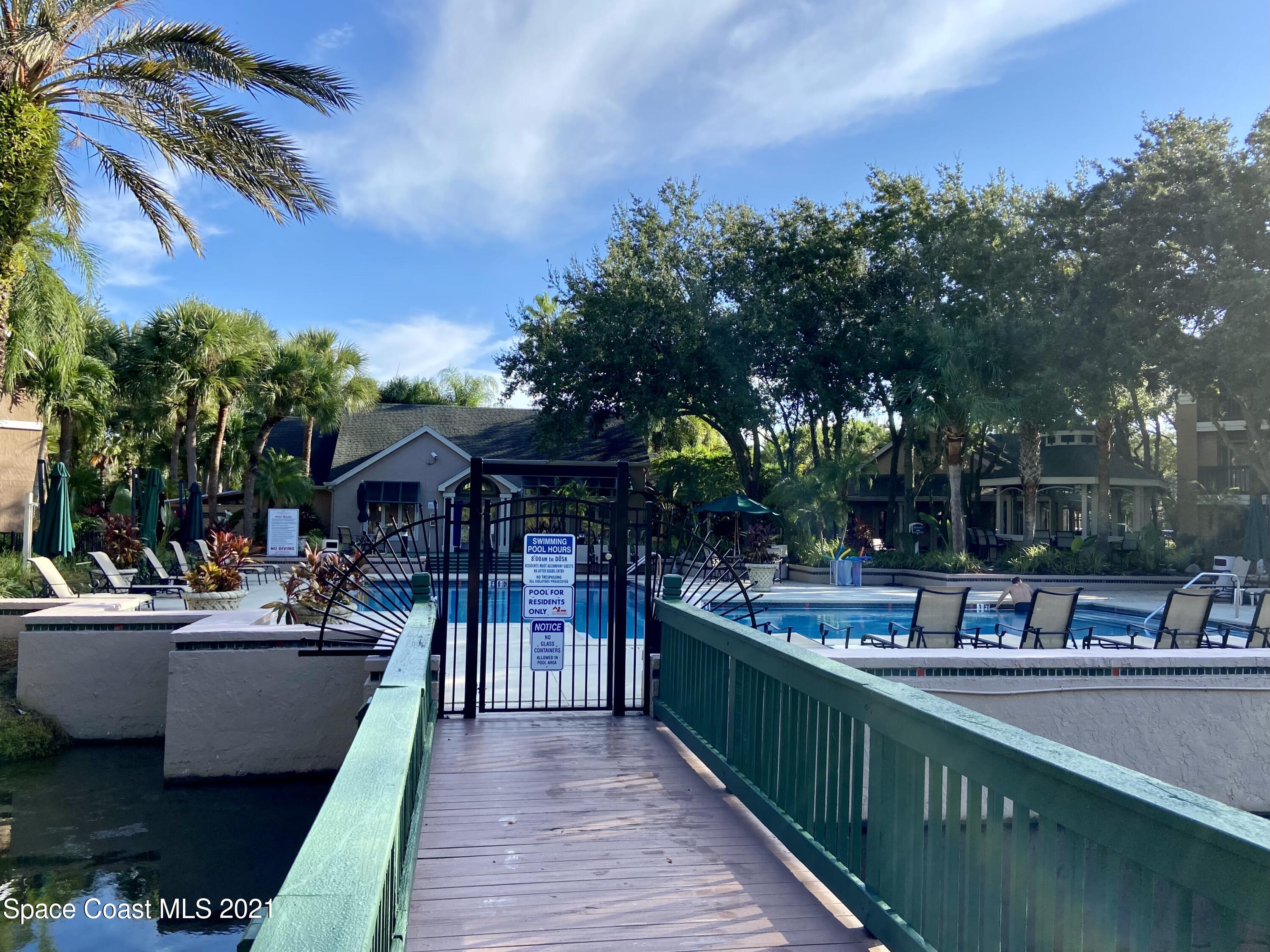 7667 North Wickham Road, Unit # 414 Melbourne, FL 32940 - Photo 20 of 24 Bridge from Fitness Center to Pool