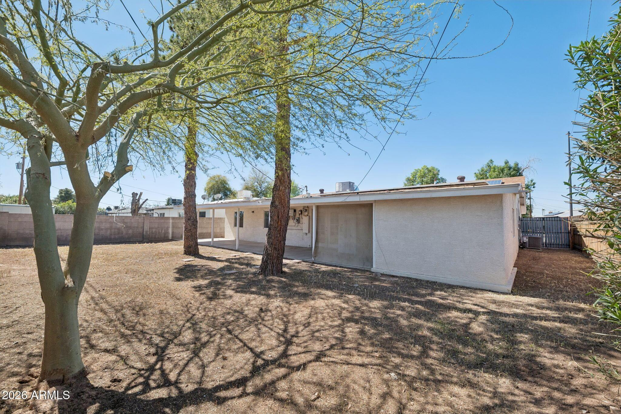 7 South Catalina Street Gilbert, AZ 85233 - Photo 29 of 34 a view of a backyard of the house