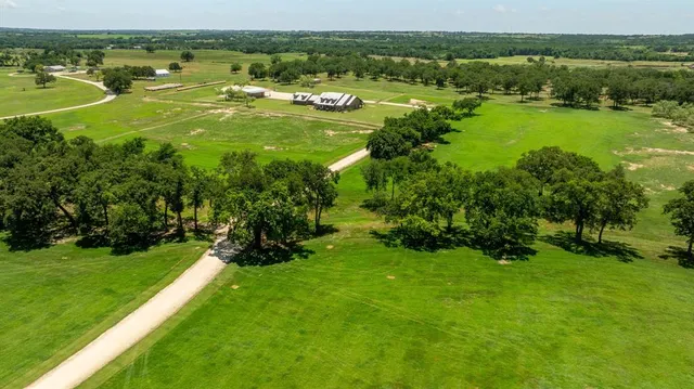 a view of a backyard and floor to ceiling window and an outdoor seating
