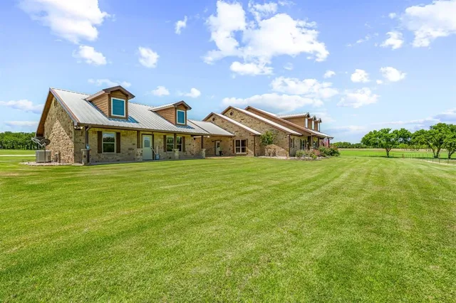 a view of a house with a big yard
