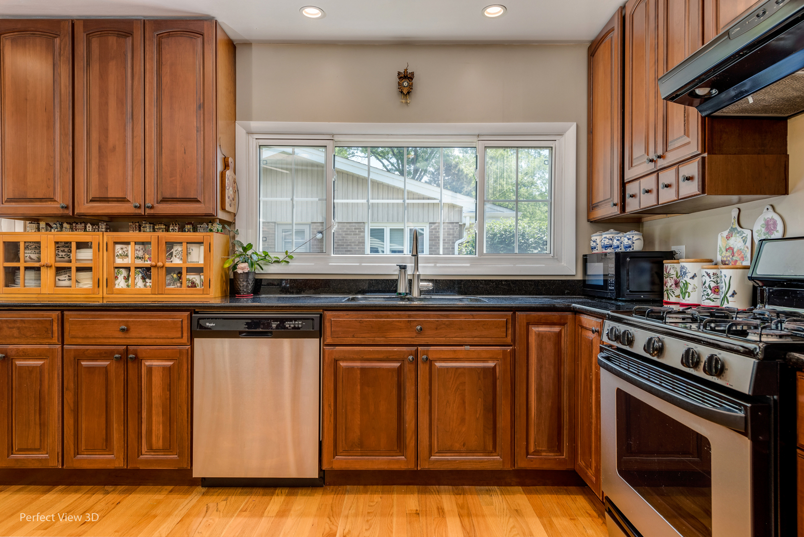 1825 Barberry Road Northbrook, IL 60062 - Photo 19 of 24 a kitchen with stainless steel appliances granite countertop a stove a sink and a microwave