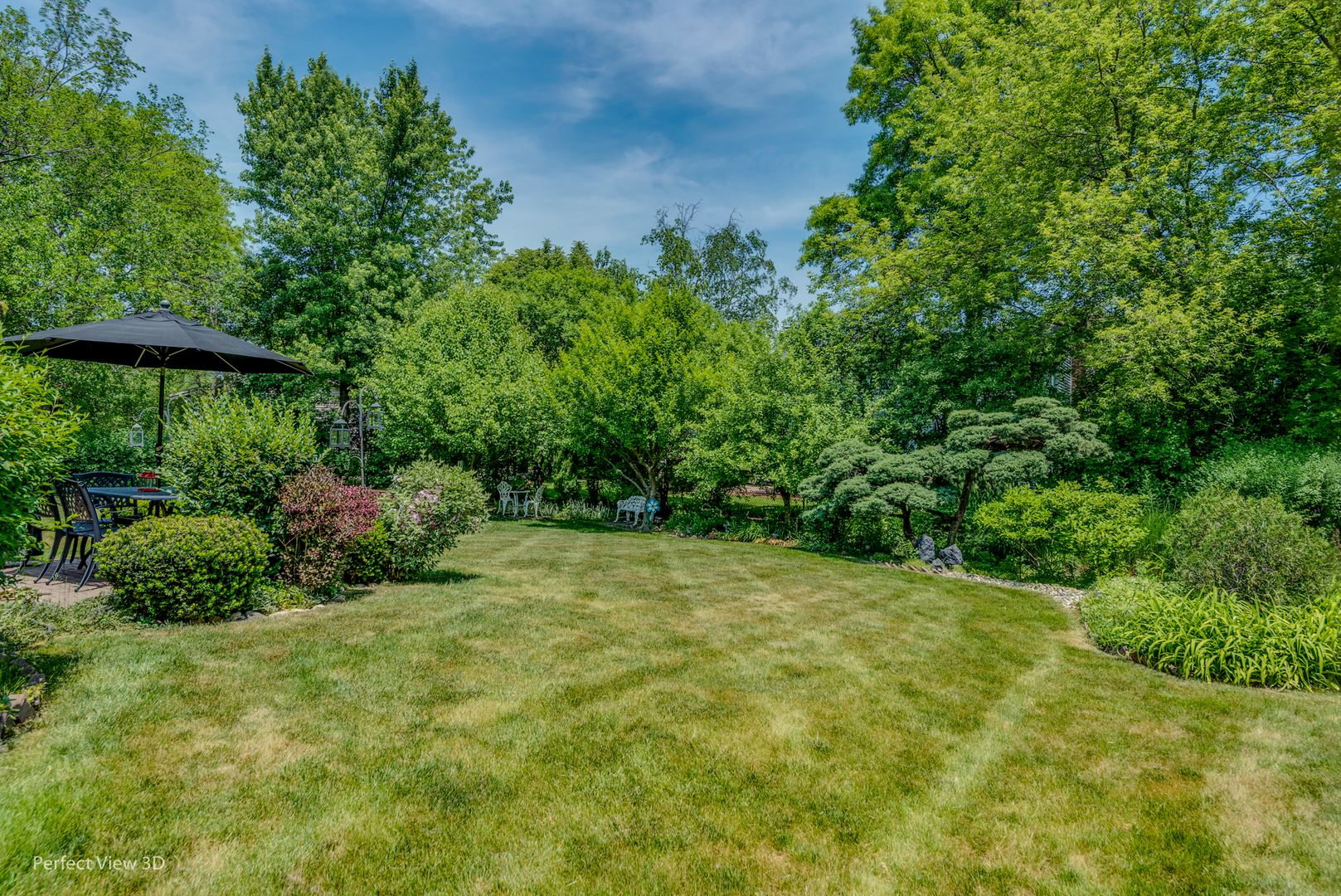 1825 Barberry Road Northbrook, IL 60062 - Photo 22 of 24 a view of a garden with a tree