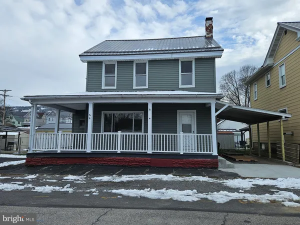 a view of a house with a fence