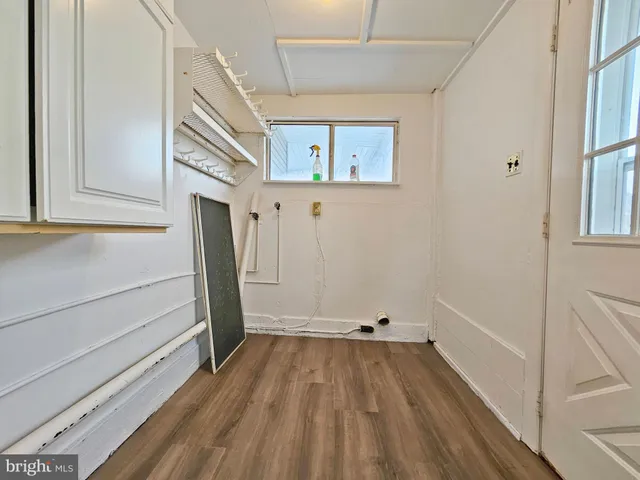 a view of a hallway view with wooden floor and staircase