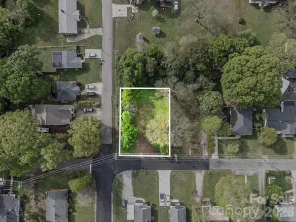 aerial view of a house with a yard