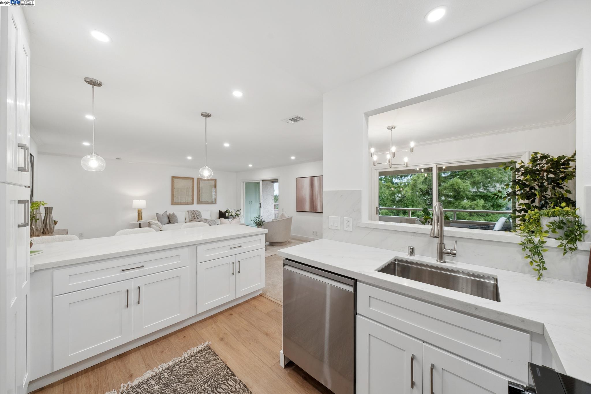 4033 Terra Granada Drive, Unit 5C Walnut Creek, CA 94595 - Photo 19 of 44 a kitchen with sink attached with living room