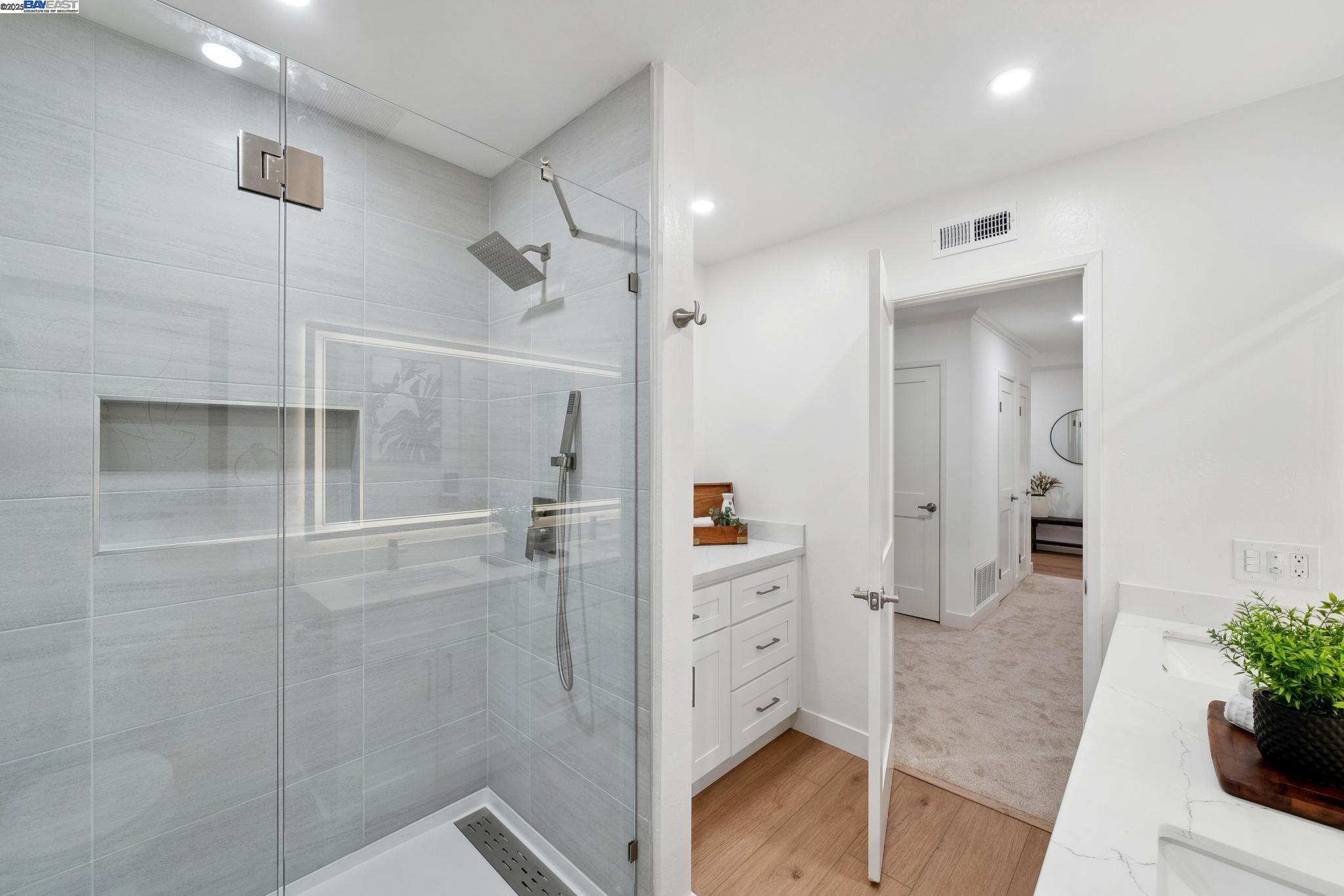 4033 Terra Granada Drive, Unit 5C Walnut Creek, CA 94595 - Photo 24 of 44 a bathroom with a shower and a sink