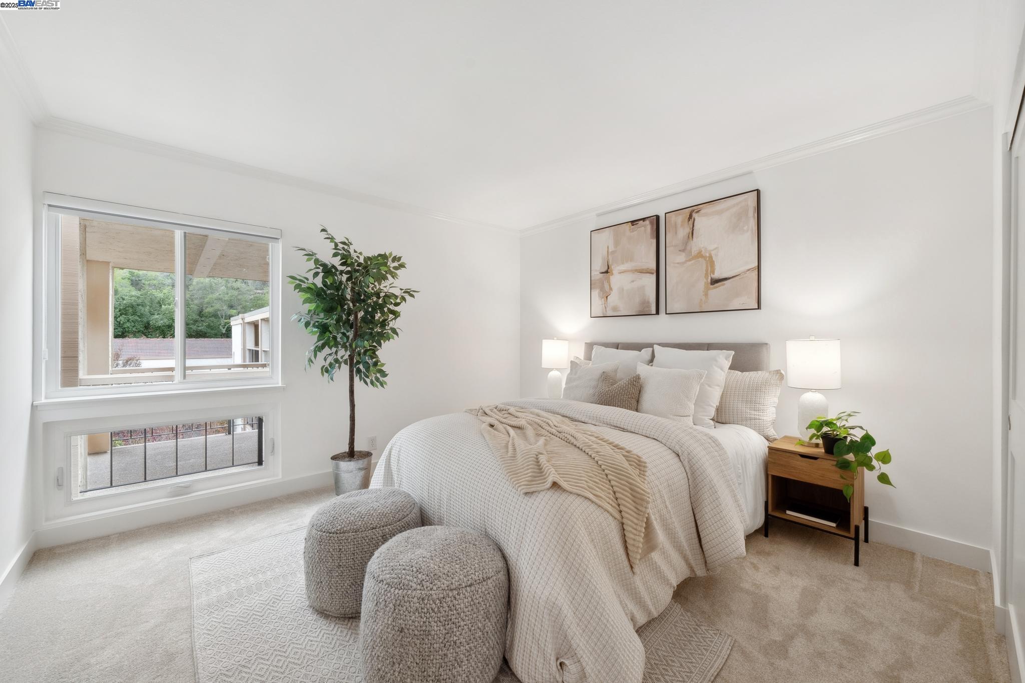 4033 Terra Granada Drive, Unit 5C Walnut Creek, CA 94595 - Photo 25 of 44 a bedroom with a bed and a potted plant