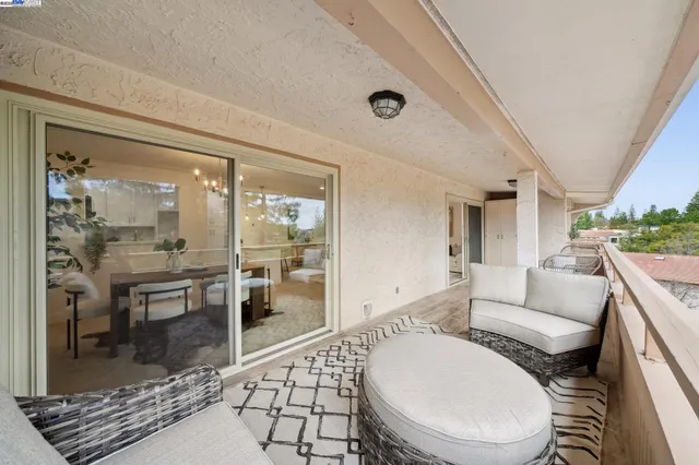 a living room with a couch and wooden floor
